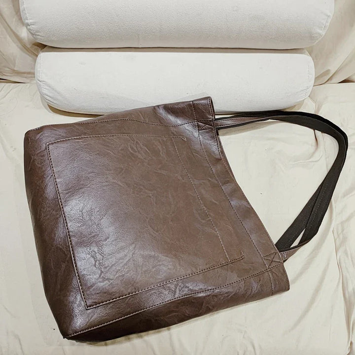 Tote bag femme mode en cuir PU, design élégant, pour un look chic et pratique.