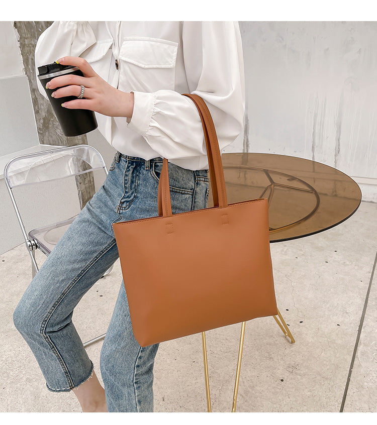 Sac épaule fonctionnel pour femme et étudiante, transport facile de livres et fournitures de cours.