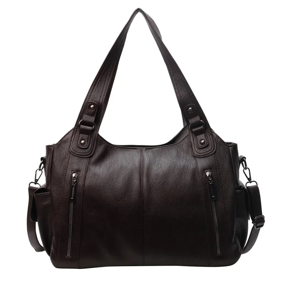 Vue détaillée du sac cabas femme élégant en similicuir, avec bandoulière amovible et poignées robustes.