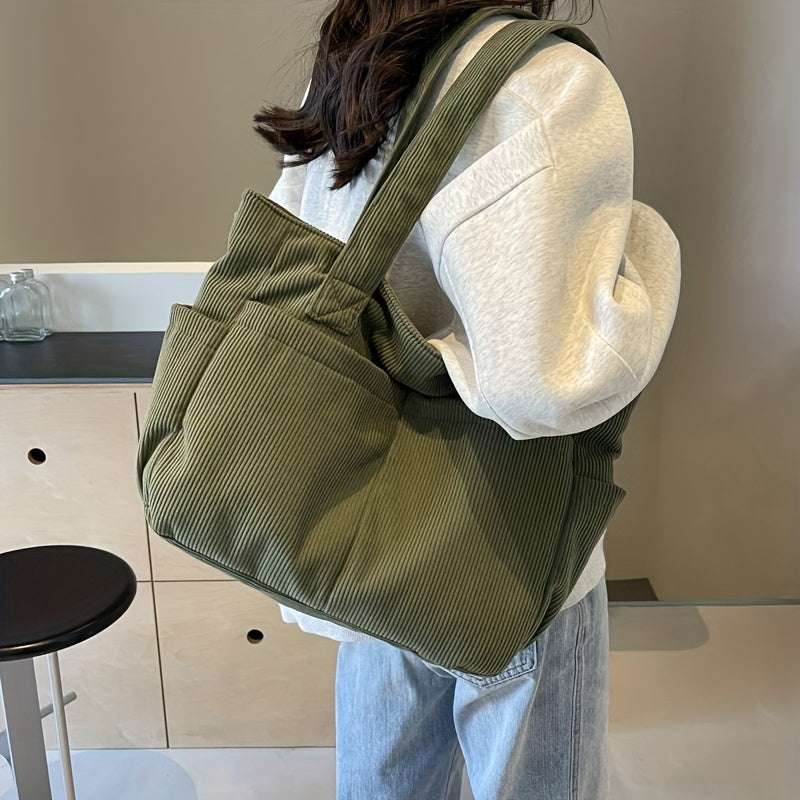 Sac à main tendance en velours côtelé pour femme, style mode française casual et chic.