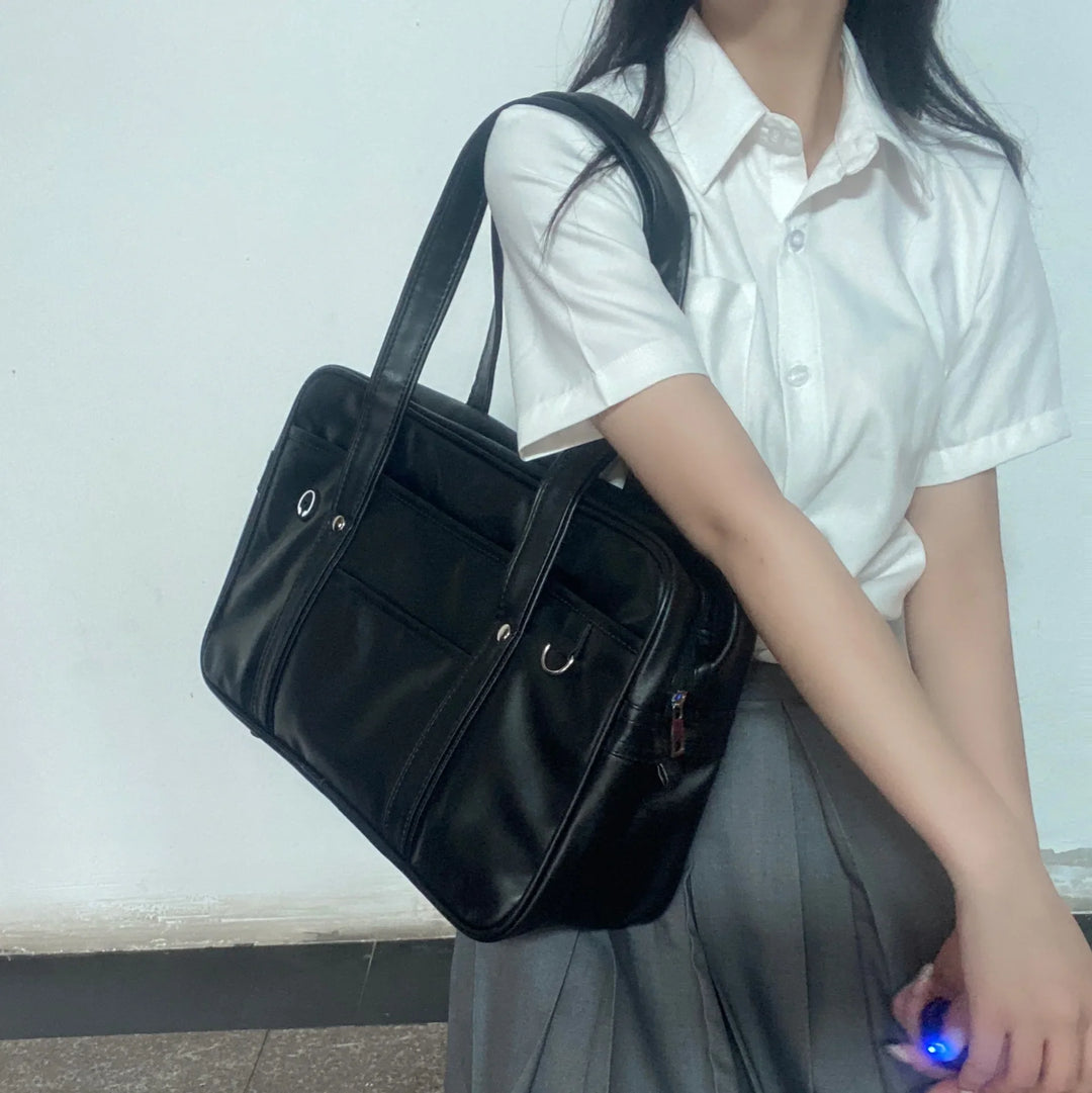 Sac cuir PU noir, grande capacité, avec bandoulière, idéal comme sac de lycée ou étudiant.