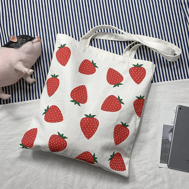 Sac cabas imprimé fraise pour femmes, en toile robuste, idéal pour le shopping ou un usage quotidien.