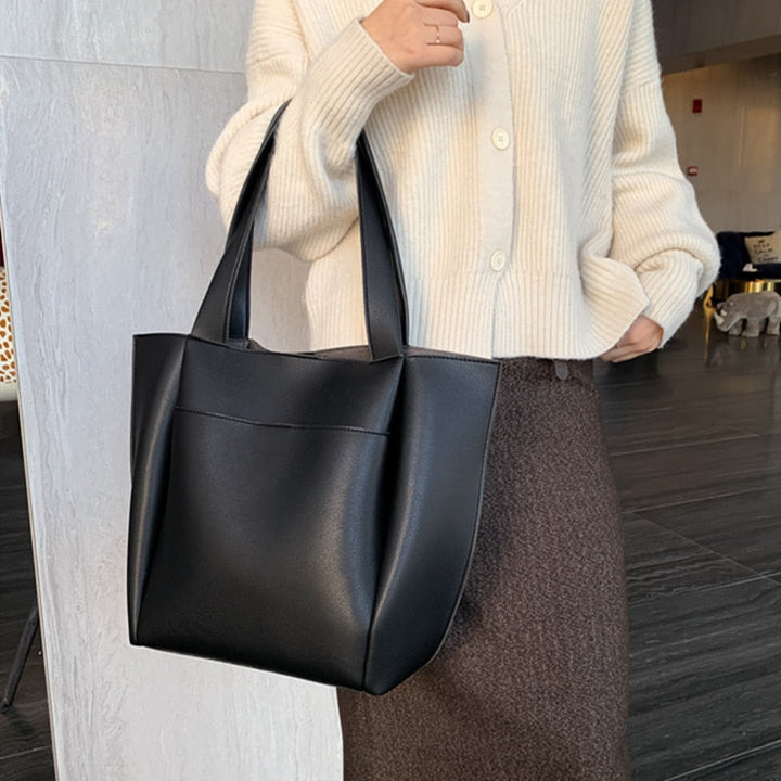 Sac cabas femme noir en PU, design élégant et moderne, accessoire de mode spacieux et fonctionnel.