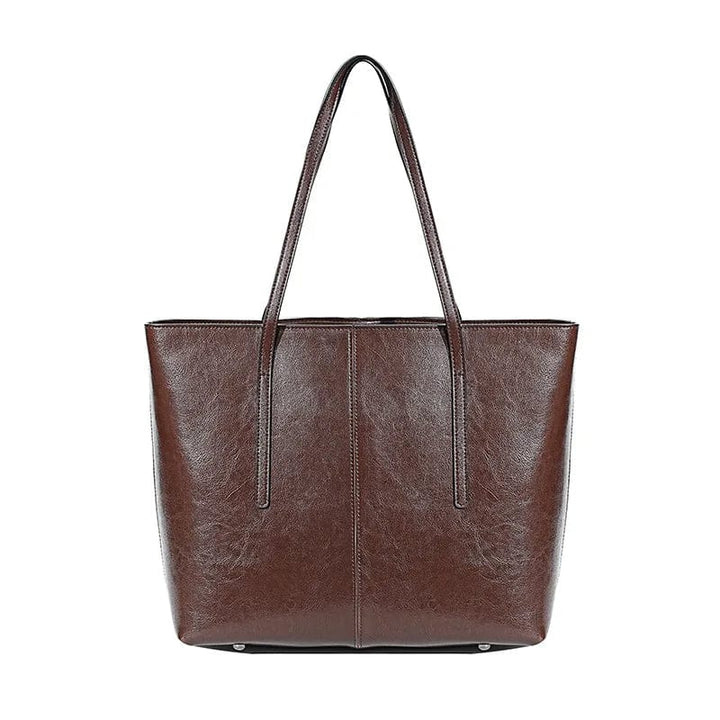 Sac cabas ordinateur femme marron en cuir véritable, moderne, robuste et élégant, parfait pour le travail ou les études.
