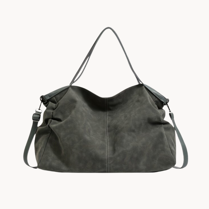 Sac cabas vert bouteille en cuir, modèle oversize avec bandoulière, élégant et très spacieux pour femme.