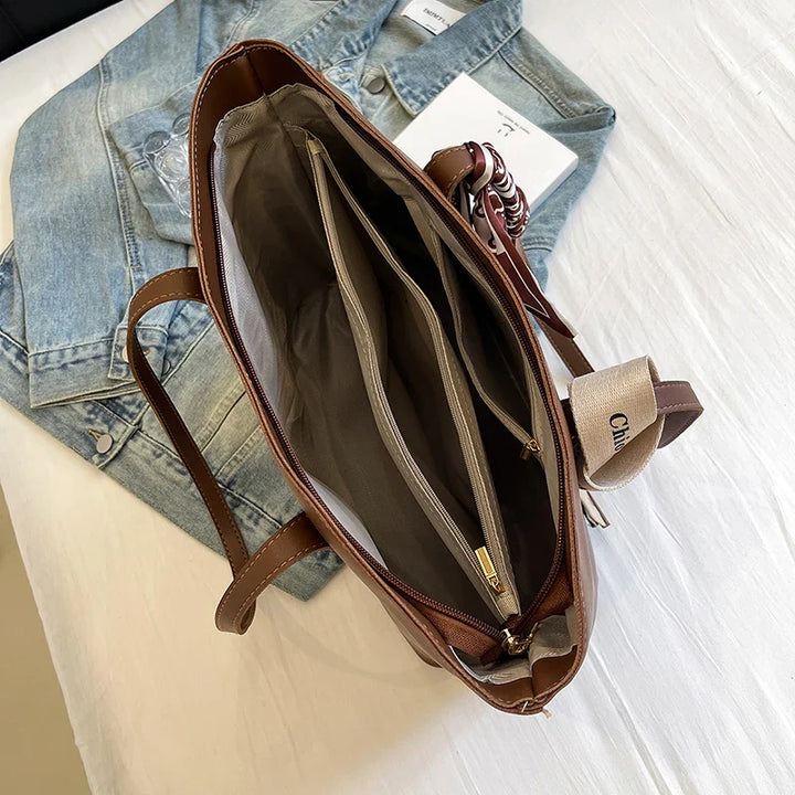 Sac à main cabas noir pour femme, grand et pratique en similicuir écologique, style quotidien élégant.