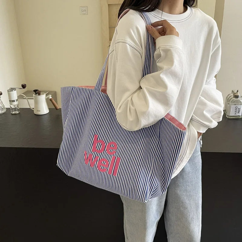 Sac en toile réversible pour femme, grand cabas shopping robuste et élégant, parfait pour le quotidien.