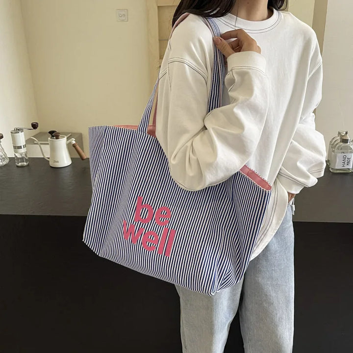 Sac en toile réversible pour femme, grand cabas shopping robuste et élégant, parfait pour le quotidien.