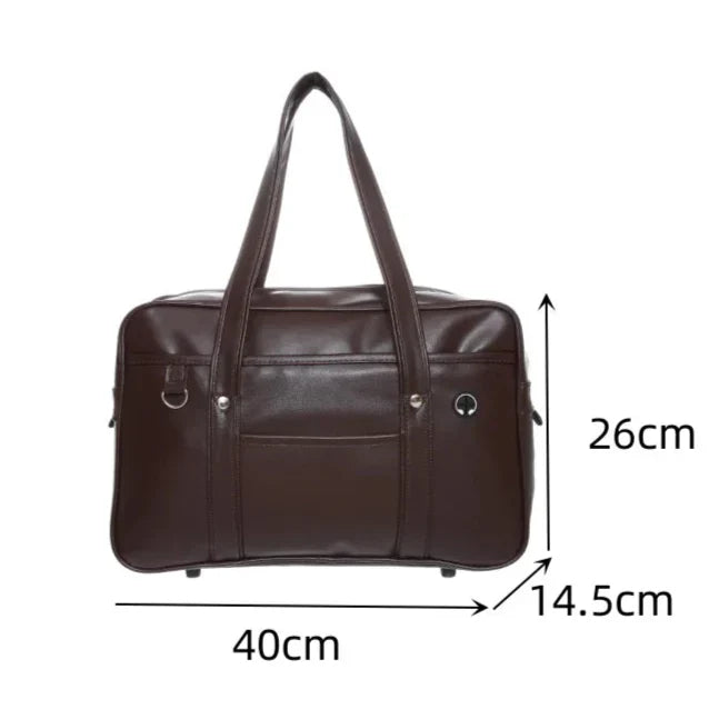 Sac cabas stylé pour lycéennes, cuir PU noir, spacieux, avec compartiment ordinateur portable et poches pratiques.