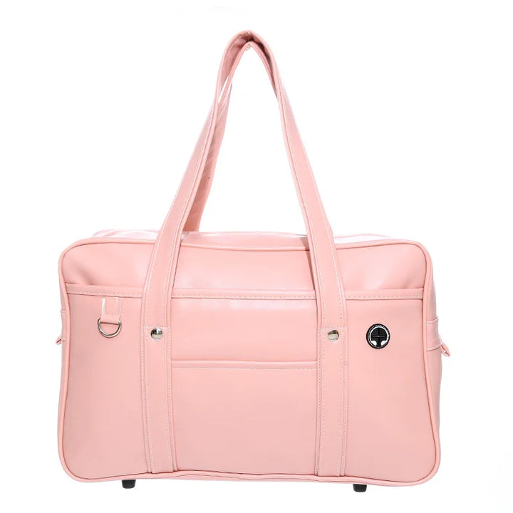 Sac cabas stylé pour lycéennes, cuir PU noir, spacieux, avec compartiment ordinateur portable et poches pratiques.