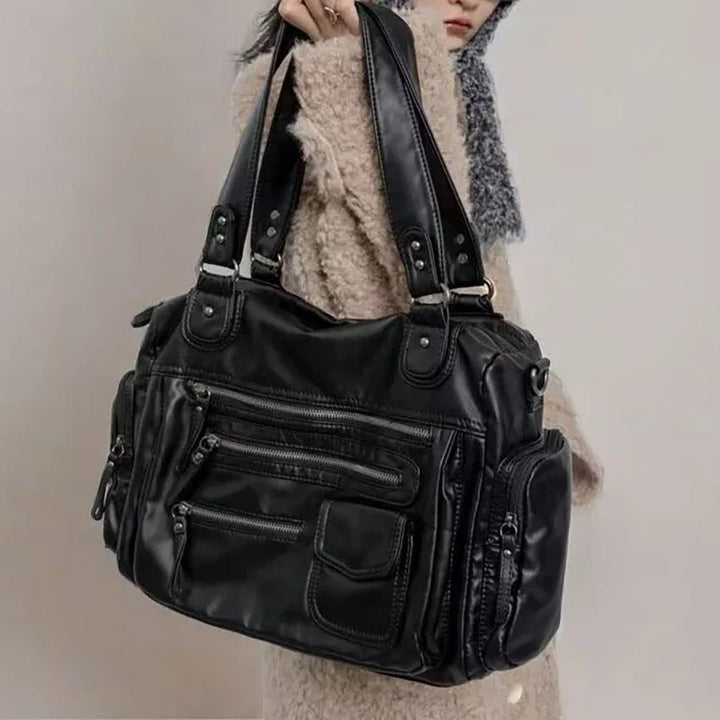 Sac cabas vintage noir pour femmes élégantes en cuir synthétique, style rétro chic.