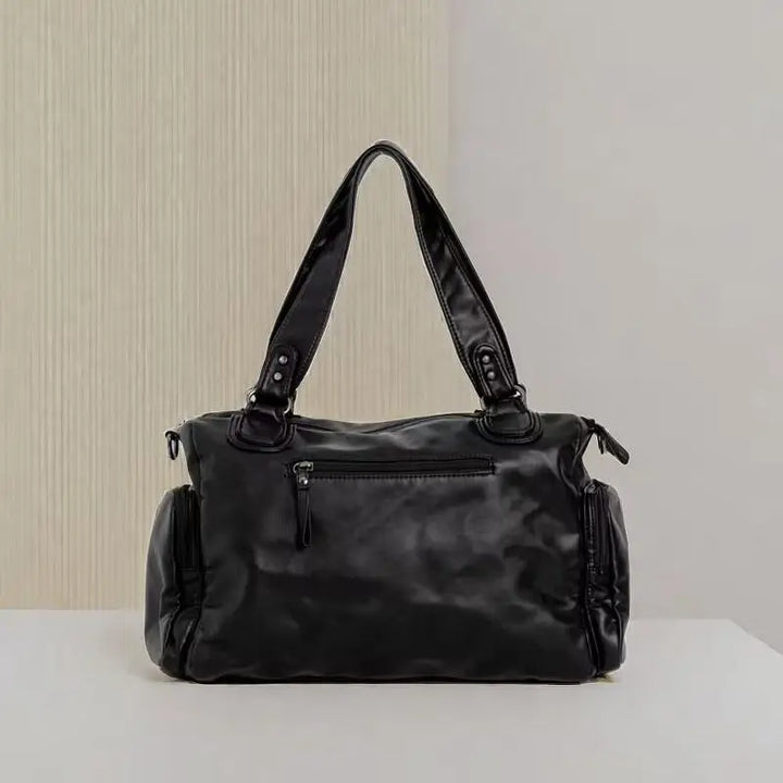 Grand sac cabas noir en cuir synthétique, design vintage chic pour femme, idéal pour le quotidien.
