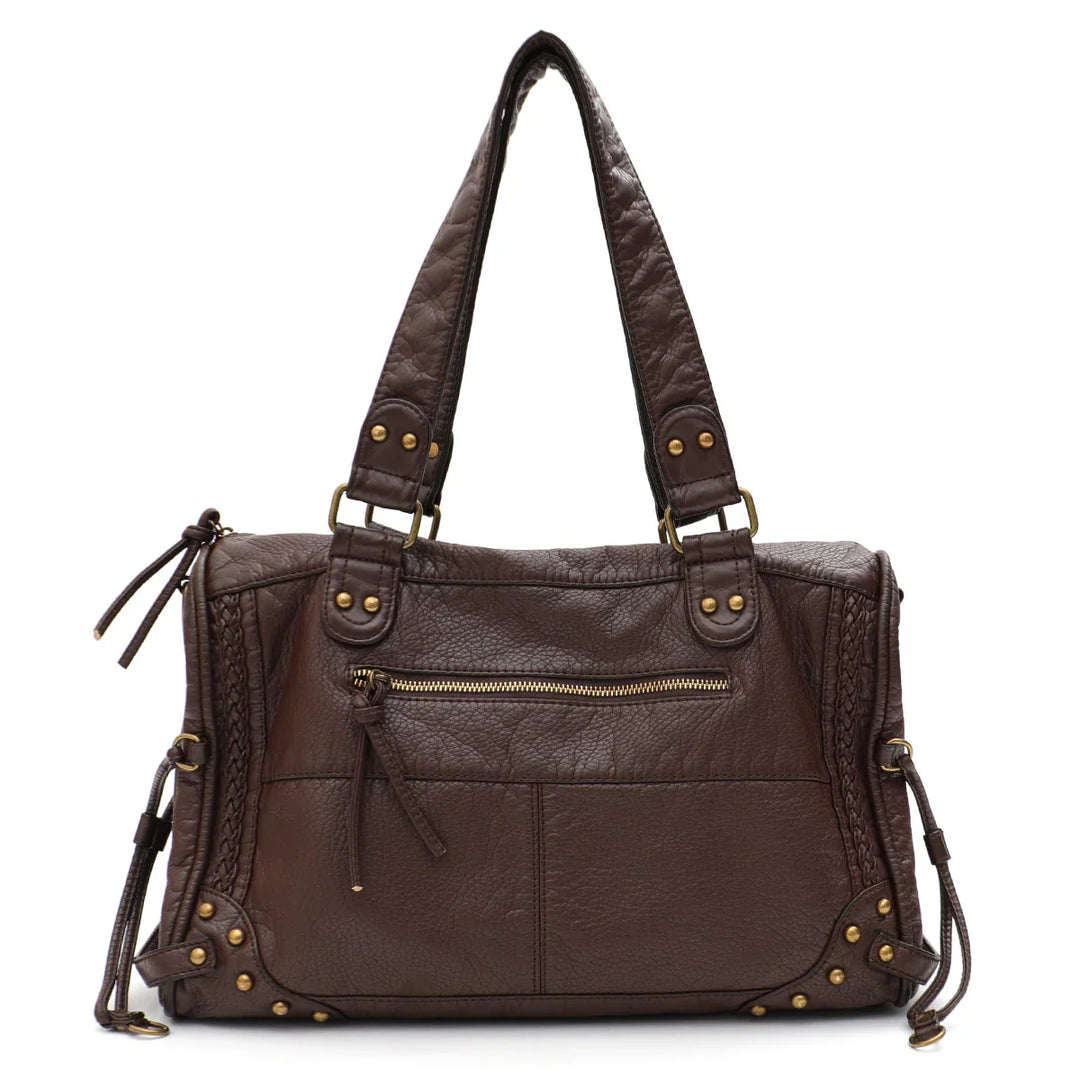 Gros plan sur les détails du sac d'épaule cabas, texture du cuir synthétique et coutures solides, qualité assurée
