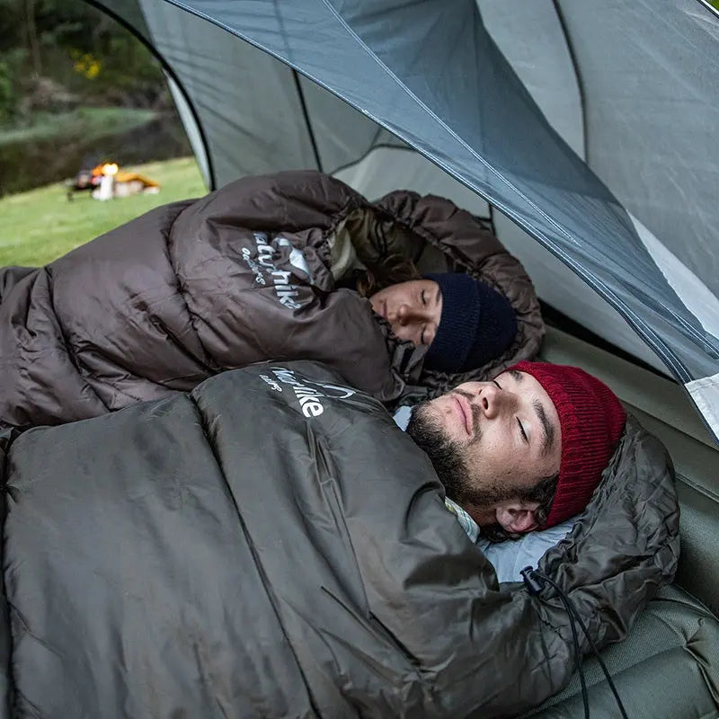 "Sac de couchage outdoor ultraléger gris, design ergonomique, isolation thermique optimale pour camping et trek."