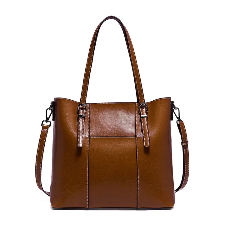 Sac à main élégant en cuir pour femme, design cabas intemporel avec bandoulière réglable.