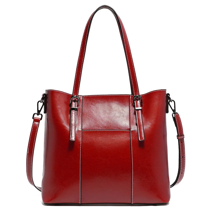 Sac de cours femme en cuir, style cabas intemporel, alliant élégance et fonctionnalité.