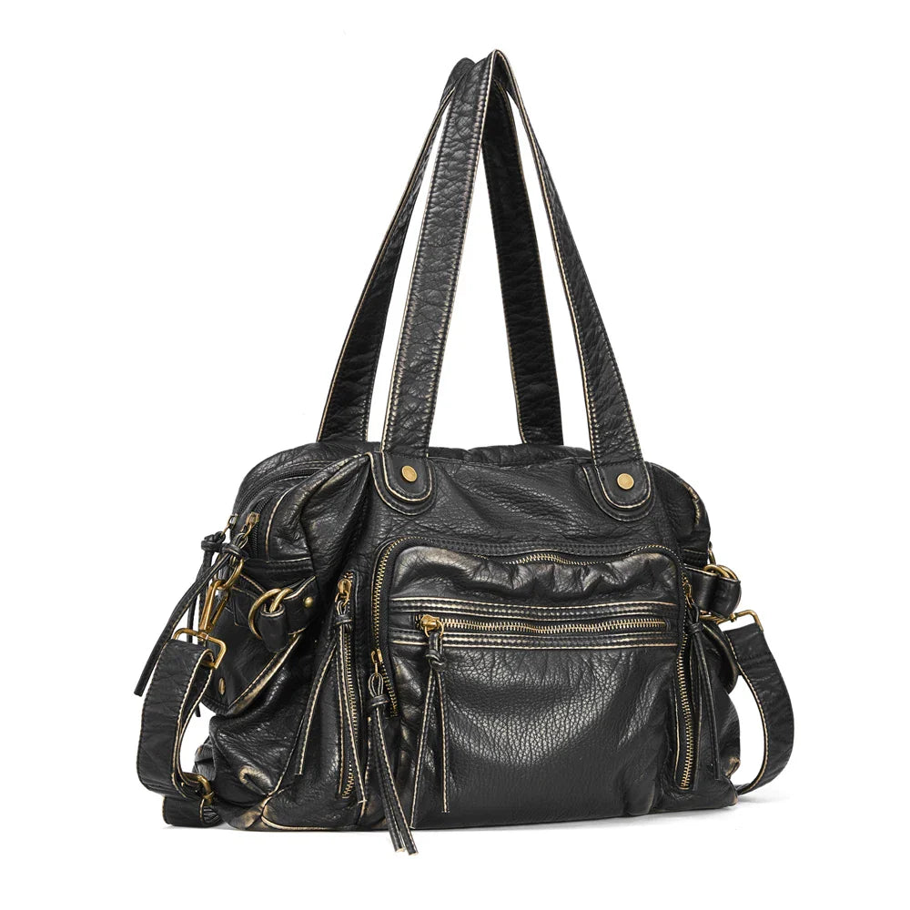 Sac femme polyvalent noir style vintage rock, porté épaule ou bandoulière, accessoire tendance.