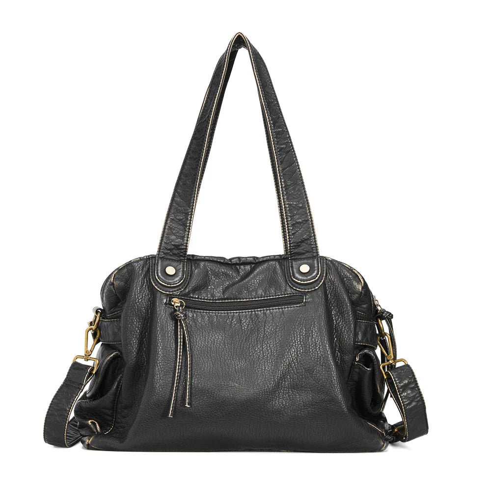 Grand sac noir pour femme en cuir synthétique, idéal comme sac de cours avec espace suffisant.