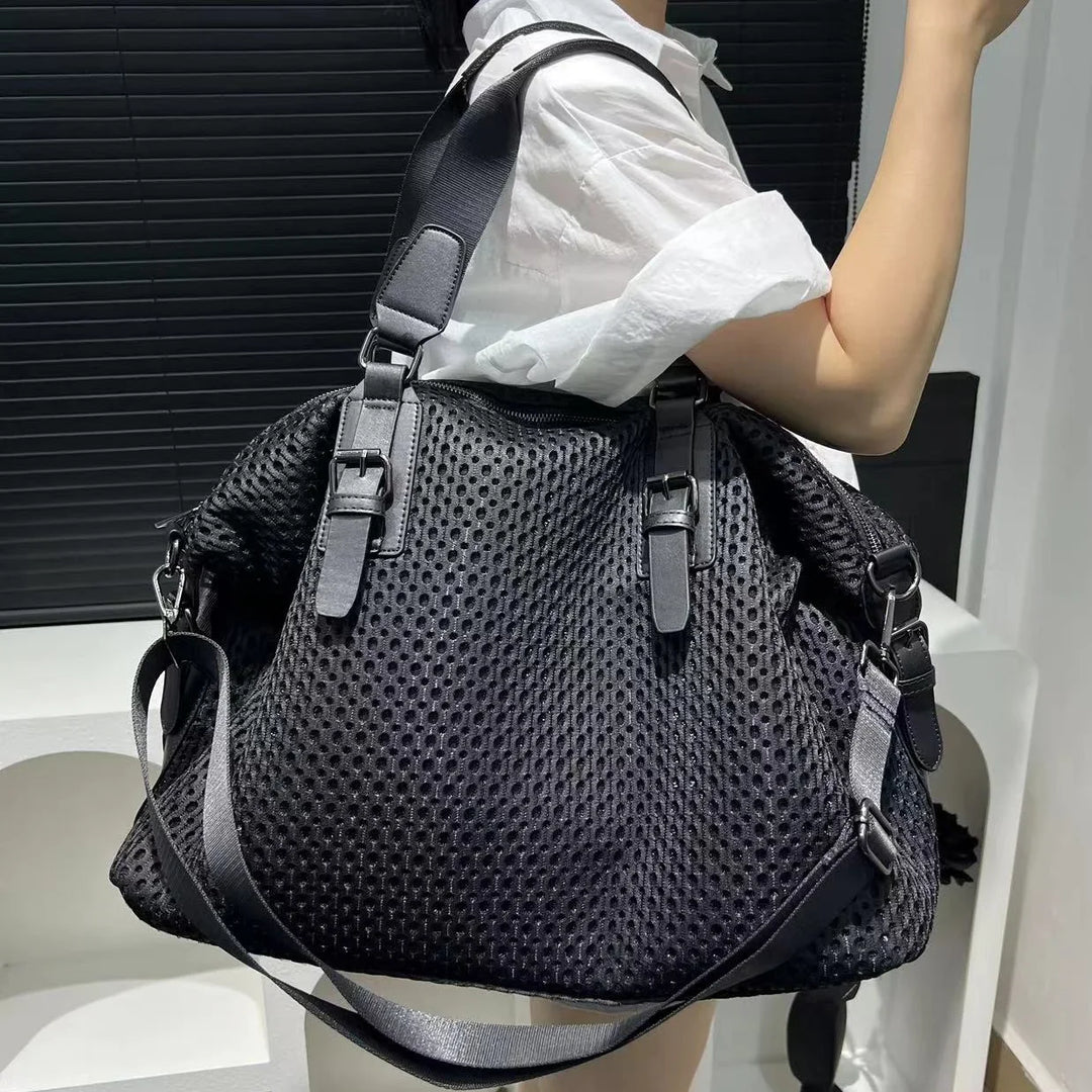 Sac de cours femme noir en nylon, élégant et pratique avec bandoulière réglable pour étudiante ou usage quotidien.