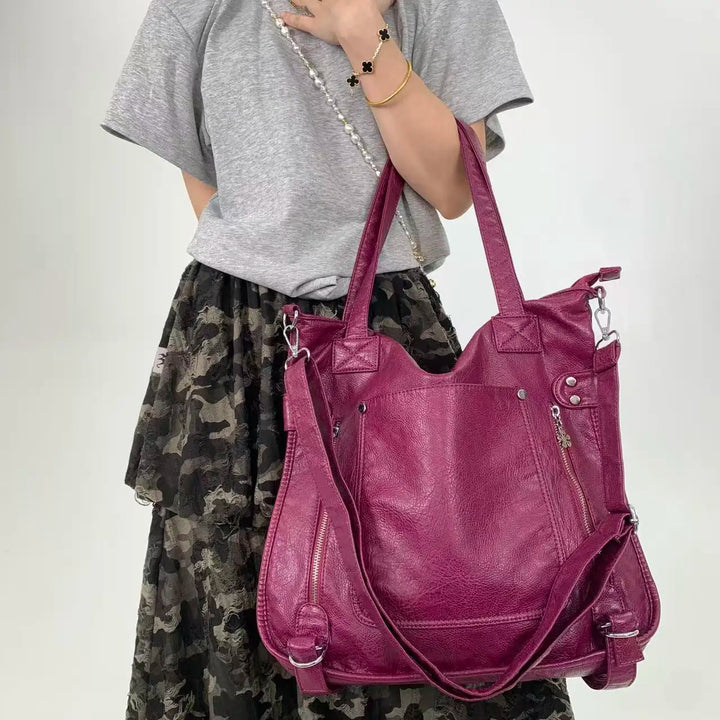 Sac à main polyvalent noir pour femme, parfait pour le cours, le travail ou les sorties.