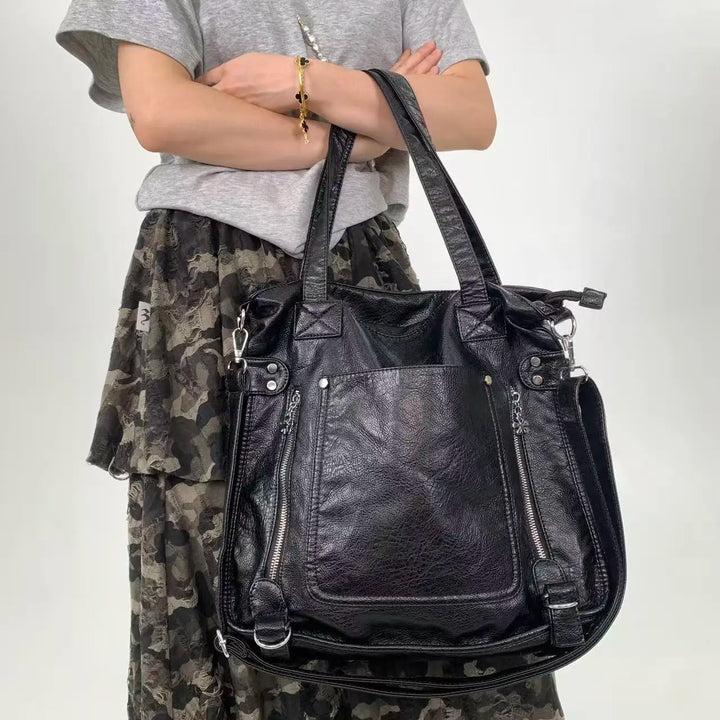Élégant sac à main femme en similicuir noir, idéal comme sac de cours scolaire ou accessoire quotidien.