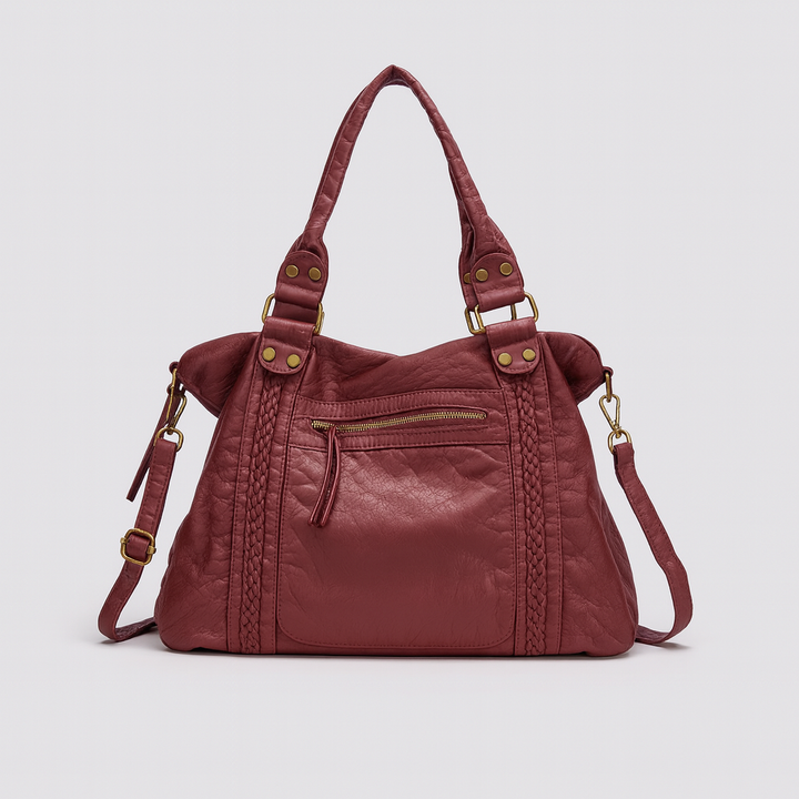 Intérieur spacieux du sac de cours vintage pour femme, montrant des livres, tablette, parfait pour étudiante.