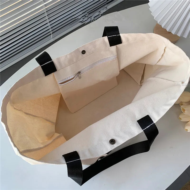 Sac cabas femme beige XL pour la plage ou le voyage, en toile robuste et tendance.