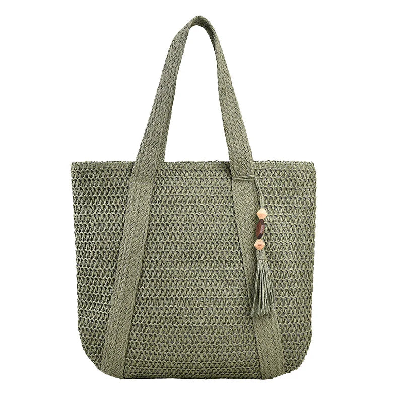 Sac de plage femme style bohème en paille et coton, alliant élégance et praticité pour l'été.