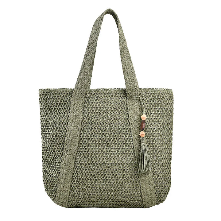 Sac de plage femme style bohème en paille et coton, alliant élégance et praticité pour l'été.