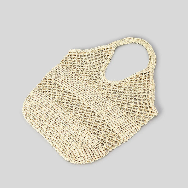 Sac de plage filet bohème femme, style paille pour un été tendance. Accessoire de plage chic et pratique.