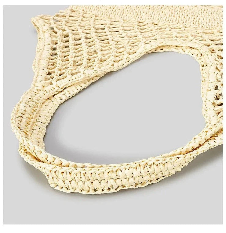 Sac de plage filet bohème en paille tressée pour femme, grand et spacieux, l'accessoire estival parfait.