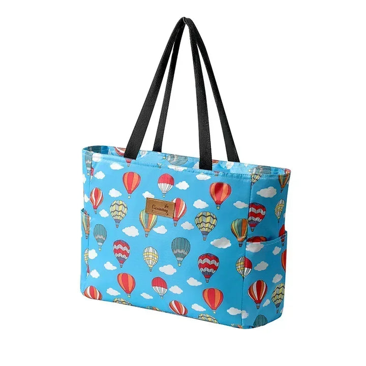 Sac cabas femme grande capacité isotherme, accessoire indispensable plage et pique-nique, motif estival.