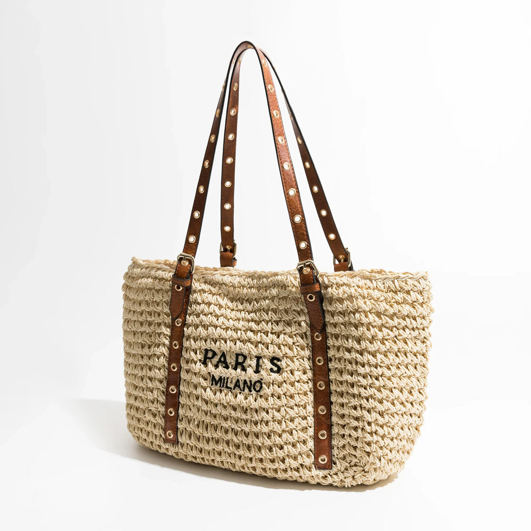 Sac d'été bohème chic pour femme en raphia. Accessoire mode élégant pour la plage ou les vacances ensoleillées.