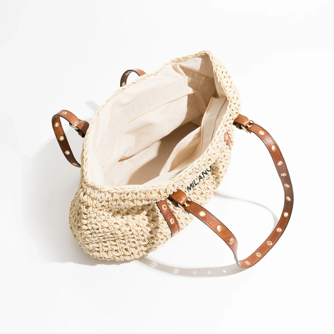 Sac de plage femme en raphia tressé, design élégant et chic. Un cabas spacieux pour un look estival sophistiqué.