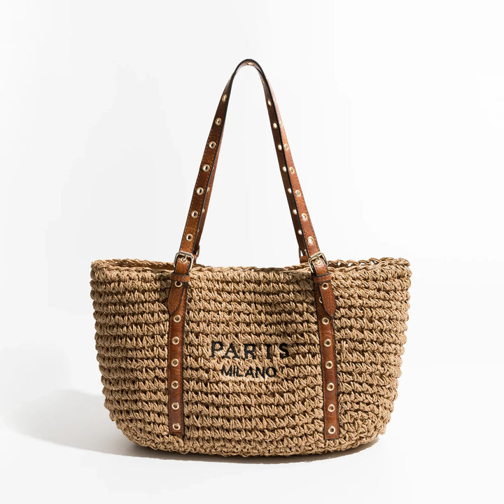 Sac de plage femme en raphia tressé chic, parfait pour un look bohème élégant. Accessoire indispensable pour l'été.