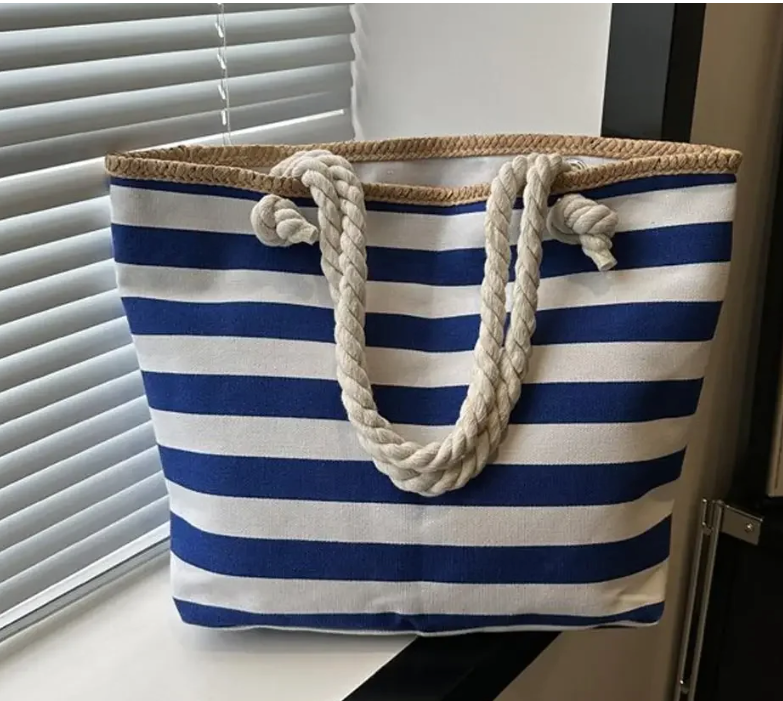 Sac de plage élégant en toile canvas pour femme, avec fermeture éclair, parfait pour l'été et les vacances.