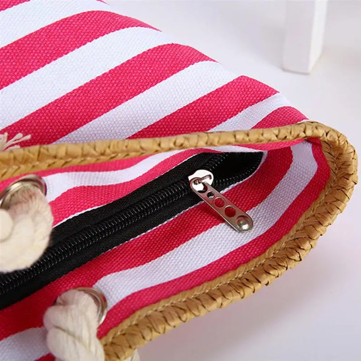 Sac de plage femme élégant en toile canvas, sécurisé par fermeture éclair, idéal pour vos accessoires d'été.
