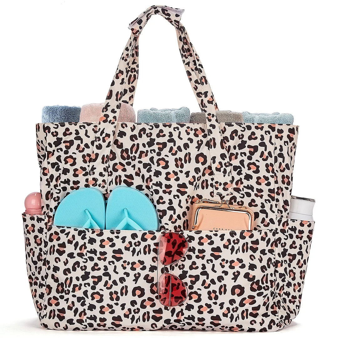 Sac de plage XXL imperméable pour femme, idéal été, vacances bord de mer. Grand fourre-tout stylé.