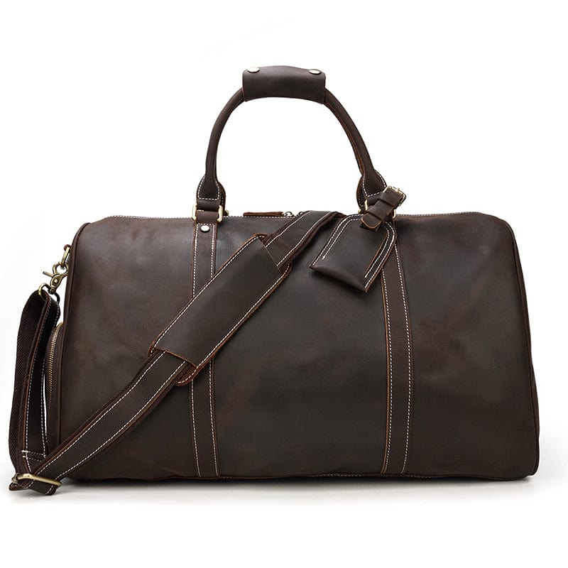 Sac de voyage en cuir marron clair pour homme, avec des poignées solides, un design vintage chic.
