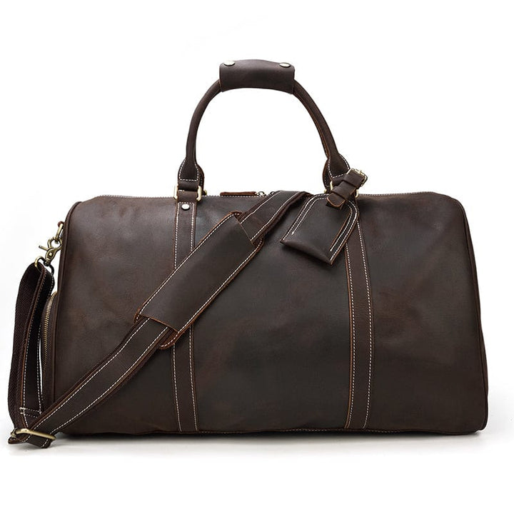 Sac de voyage en cuir marron clair pour homme, avec des poignées solides, un design vintage chic.