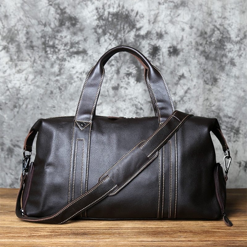 Sac de voyage homme en cuir noir, élégant, idéal pour weekend ou affaires, vue complète.