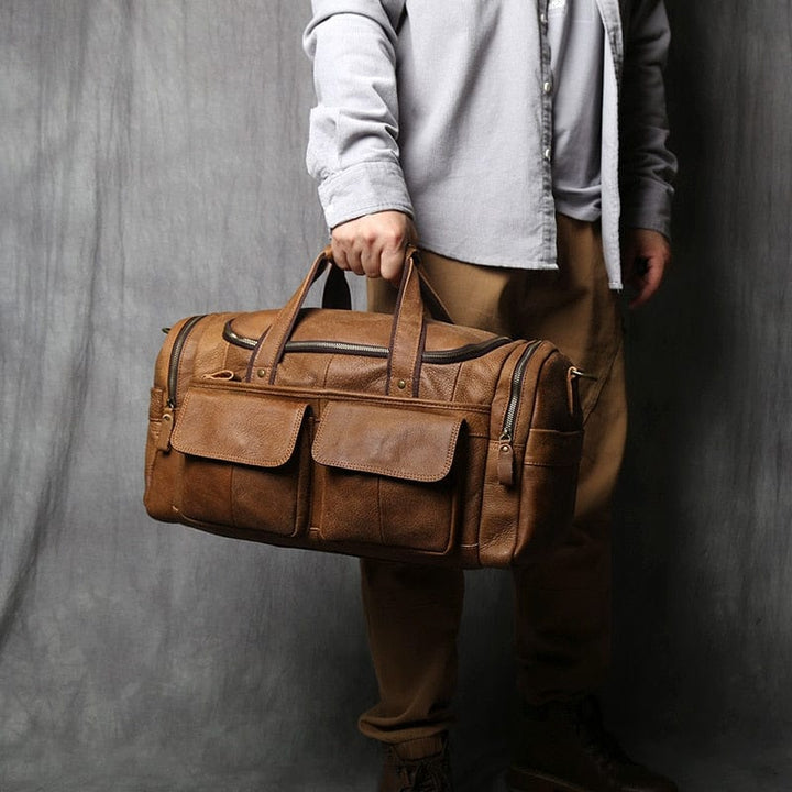 Sac de voyage homme en cuir véritable marron, grand format, idéal pour week-end.