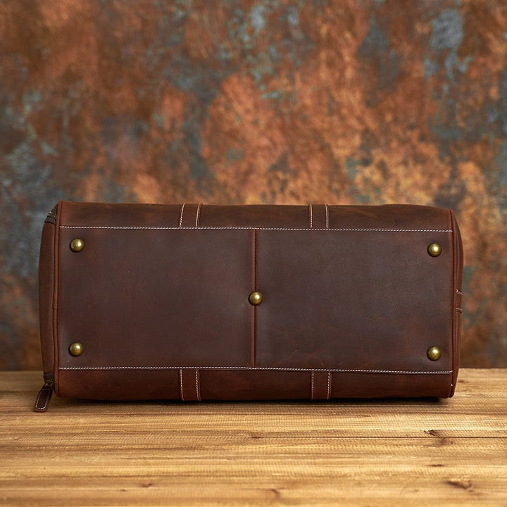Vue intérieure sac voyage homme cuir, doublure textile, compartiments spacieux, organisation facile
