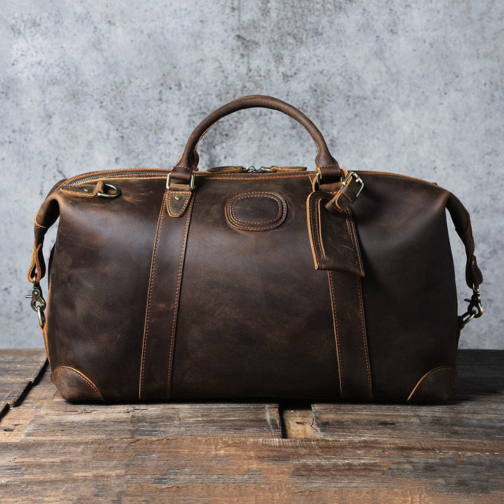 Sac de voyage homme polyvalent en cuir, pouvant servir de sac de sport ou de bagage à main.