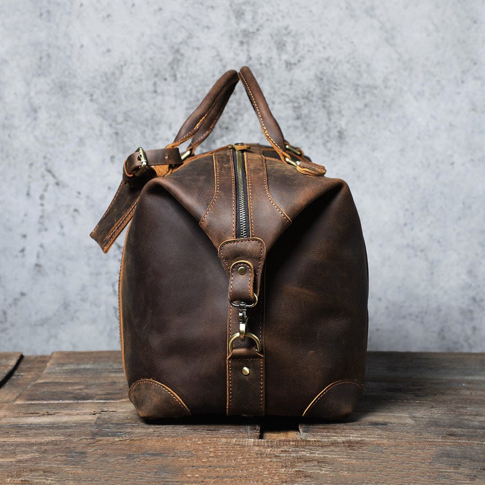 Sac de voyage homme en cuir véritable, grand compartiment, une pièce essentielle pour tout voyage.