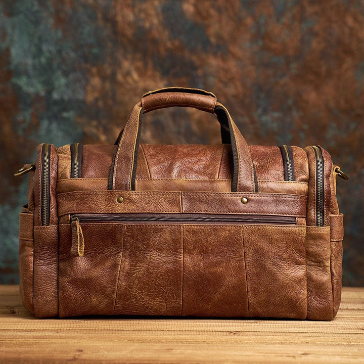 Sac de voyage en cuir veritable noir pour homme, parfait comme bagage à main, style business.