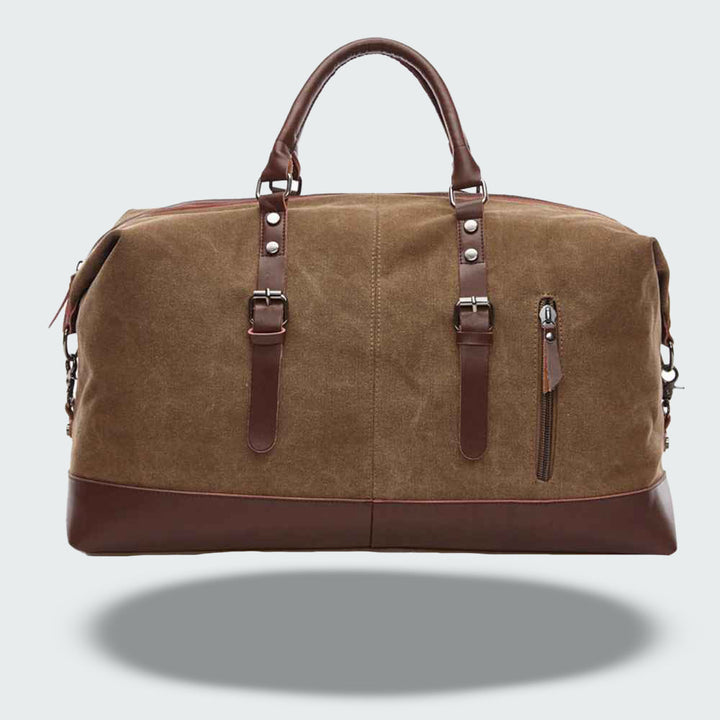 Sac de voyage vintage unisexe en toile cirée marron avec détails en cuir, idéal pour un week-end.