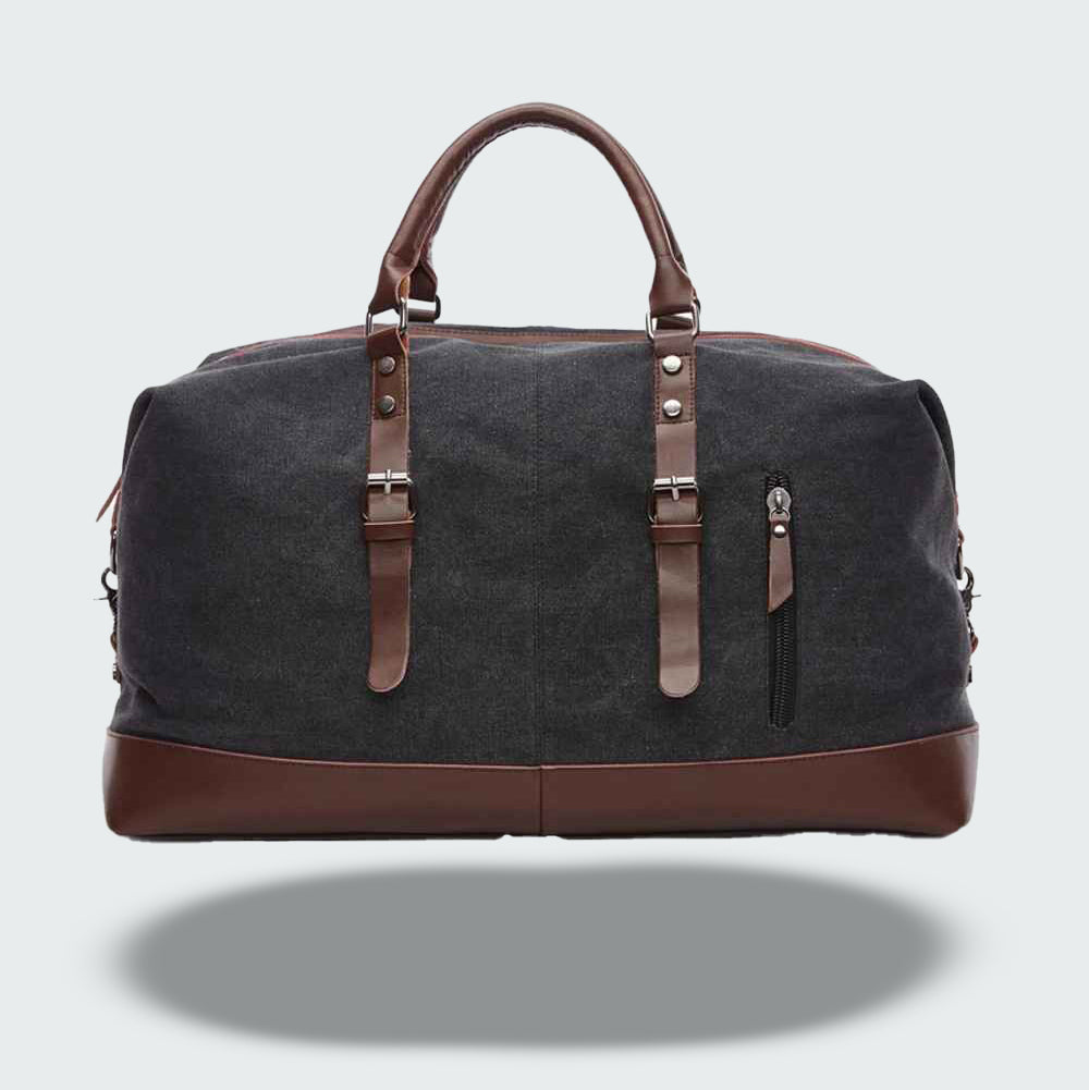 Grand sac fourre-tout de voyage vintage en toile cirée et cuir, parfait pour l'aventure.