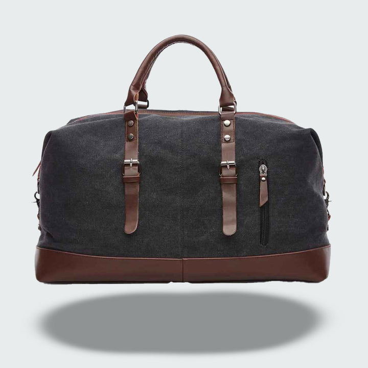 Grand sac fourre-tout de voyage vintage en toile cirée et cuir, parfait pour l'aventure.