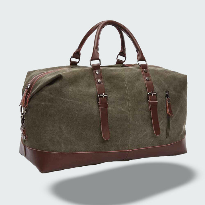Vue latérale du sac de voyage vintage en toile cirée avec poches et sangles en cuir.